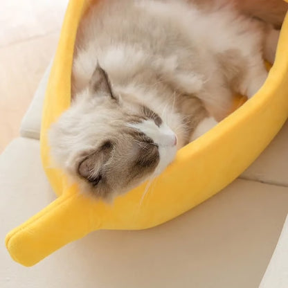 Cat lying on a yellow banana pet bed